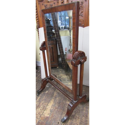 2671 - A substantial mid Victorian period mahogany framed cheval glass, the framework incorporating six col... 