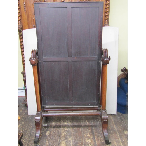 2671 - A substantial mid Victorian period mahogany framed cheval glass, the framework incorporating six col... 