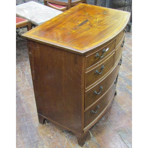 2672 - A small Edwardian mahogany chest of two long and four short drawers with bow fronted outline on swep... 