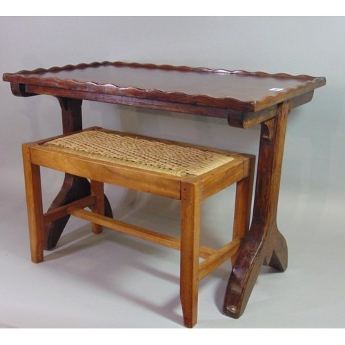 543 - An Arts & Crafts style oak occasional table of rectangular form with pie crust moulded edge, raised ... 