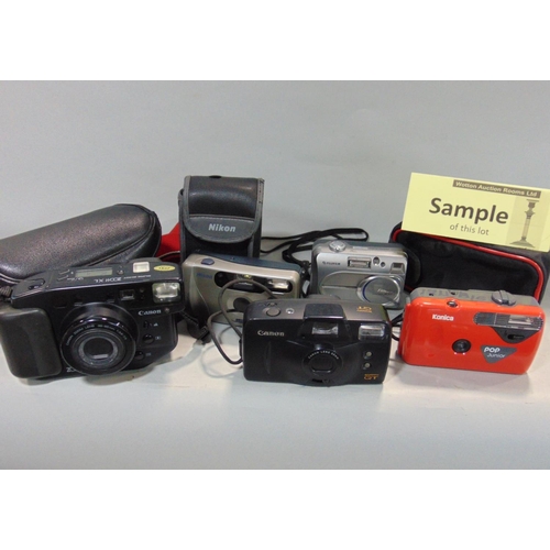 563 - Two boxes to include a large quantity of 35mm cameras to include Canon, Pentax and others