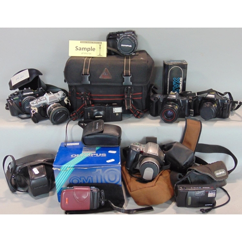 568 - An assortment of Olympus 35mm manual SLR cameras and other Olympus products to include an XA (boxed)