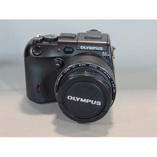 568 - An assortment of Olympus 35mm manual SLR cameras and other Olympus products to include an XA (boxed)