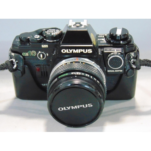 577 - Olympus OM10 outfit in metal case to include two extra lenses plus flash lights, etc.