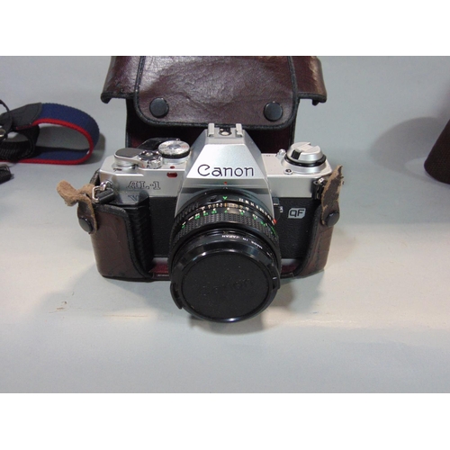 579 - Canon EOS 500 with standard zoom lens and Canon manual SLR AL1QF with lens, in Canon bag (2)