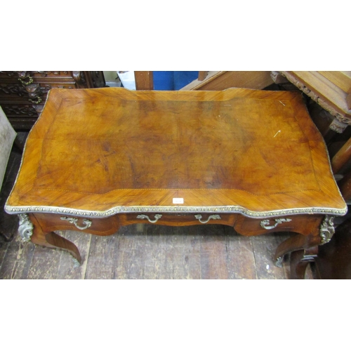 2674 - A French walnut writing desk, the top quarter panelled within wide crossbanded borders over three fr... 