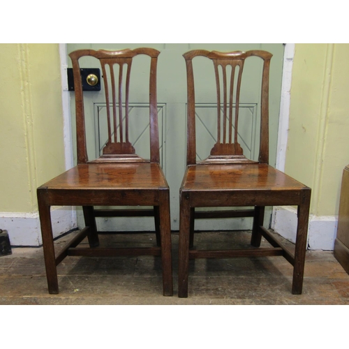 2686 - A pair of 18th century oak cottage dining/side chairs of simple form with pierced splats, shaped cre... 