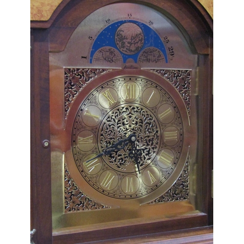 2291 - A reproduction longcase clock with arched dial and battery movement