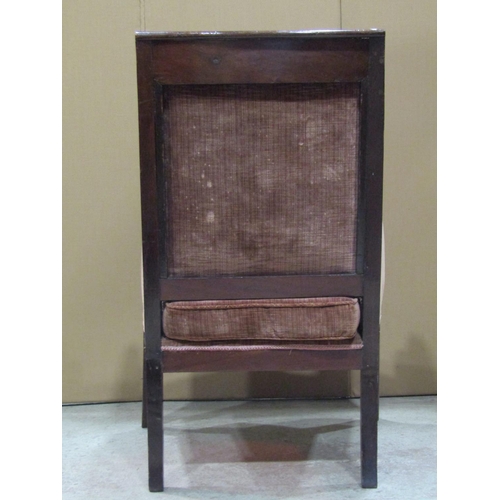 2310b - A Regency chair with upholstered seat and back with down swept carved stylised dolphin arms and sabr... 