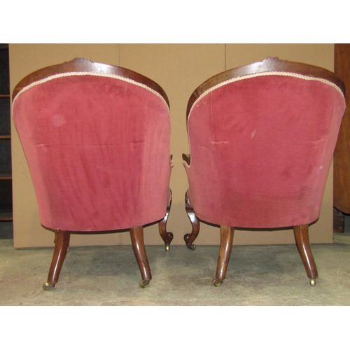 2314a - A pair of Victorian spoonback drawing room chairs with upholstered seat, button back and arms within... 