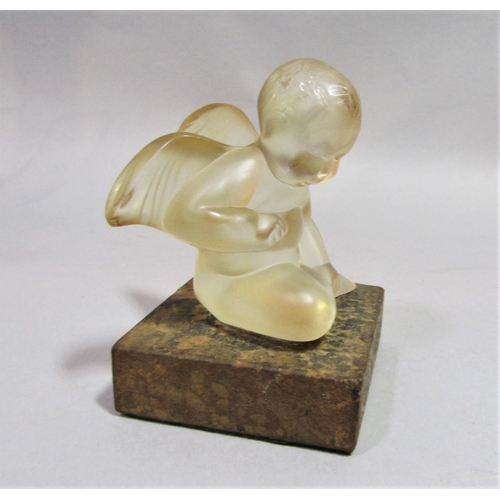 1137 - Early 20th century Lalique study of a seated putti/cherub, 8 cm high