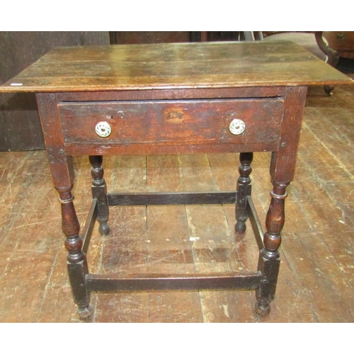 2645 - 18th century oak side table, the overhanging top above a single frieze drawer on turned supports, 76... 