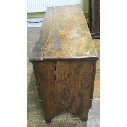 2658 - An 18th century elm six plank coffer of simple construction on shaped supports, 122 cm in length x 6... 