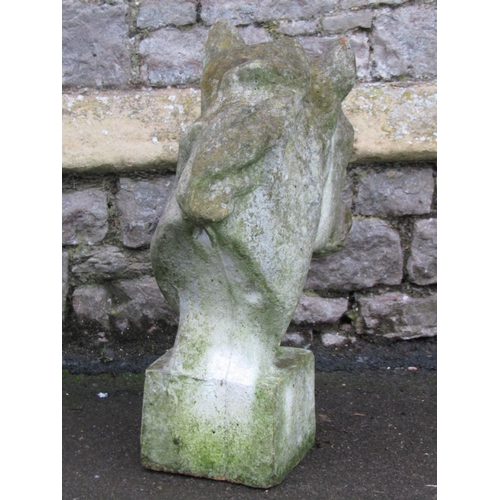 2104A - A weathered cast composition stone finial / pier cap in the form of a horse's head 61cm high