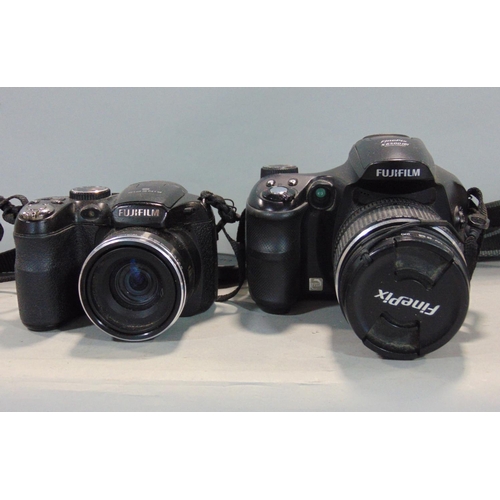 588 - Fujifilm Finepix digital camera, together with a further Fijifilm digital camera with various access... 