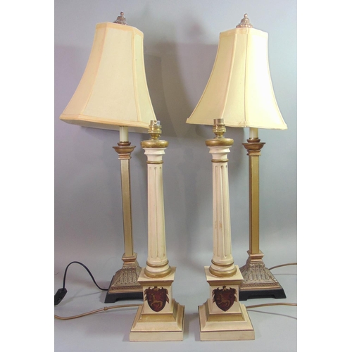 1876 - Pair of painted Corinthian column table lamps with gilt highlights and crests to the stepped square ... 