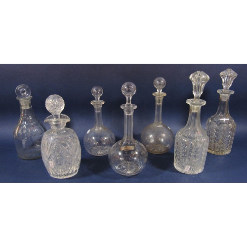 1154 - Seven glass decanters to include three graduated bottle neck decanters each etched with geometric st... 