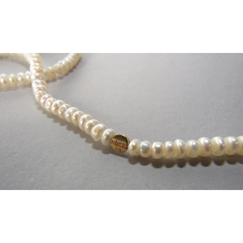 1398 - Three cultured pearl sautoir necklaces, strung with both white and pink pearls and gold and gemstone... 