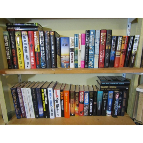 406 - An extensive collection of contemporary hard back espionage, murder mystery, adventure, etc books in... 