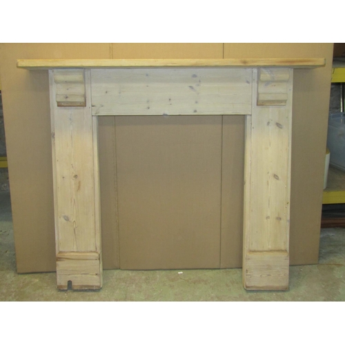 2100 - A reclaimed stripped pine fire surround with shaped corbels, the mantel 134cm wide x 116cm high, the... 