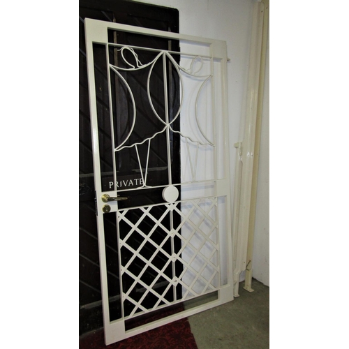 2113 - A cream painted security gate, with decorative lattice and further detail, handle lock and key (comp... 