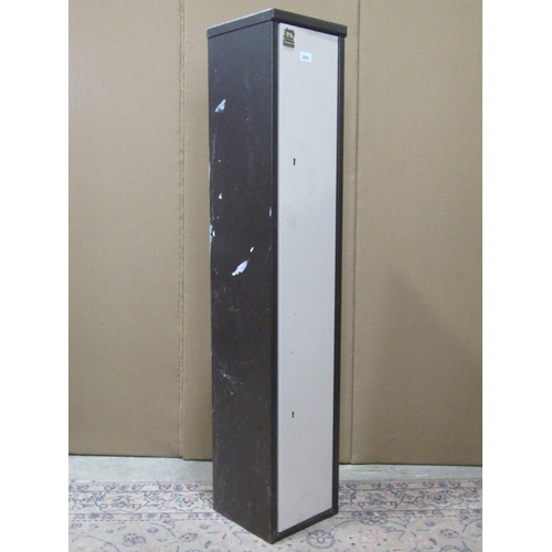 2125 - A steel gun cabinet enclosed by a single full length door with two locks and keys (brown and cream c... 