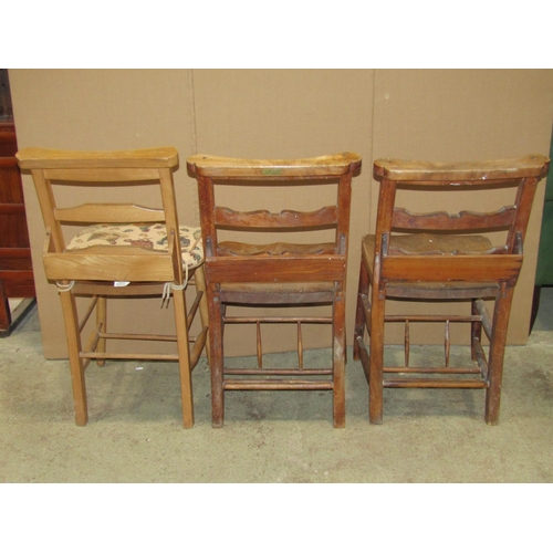 2134 - A pair of vintage stained elm and beechwood chapel chairs, with shaped bar splats and hymn book rece... 