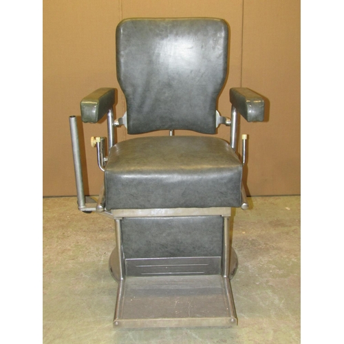 2145 - A vintage swivel and adjustable opticians chair with faux leather upholstered seat, back and arms, t... 