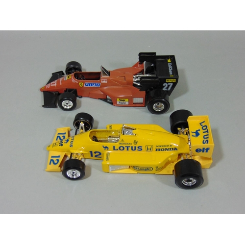 69 - 4 unboxed Formula 1 model racing cars 1:24 scale by Burago including Brabham BT52, Lotus 97T, Ferrar... 