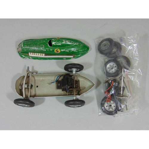 74 - 3 unboxed 1940's/50's toy cars 'The Mighty Midget Electric Racer' (AF), together with a small bag of... 