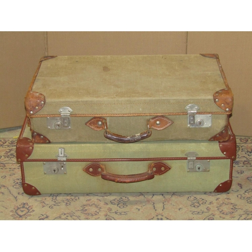 2210 - A vintage heavy gauge stitched brown leather suitcase, stamped Finnigan Maker Manchester (worn) appr... 