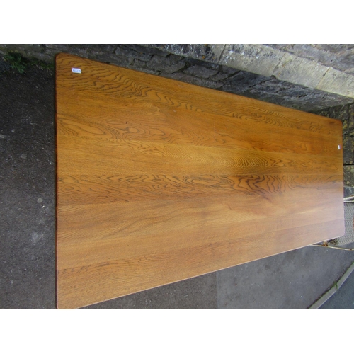 2235 - A reproduction oak refectory table, the rectangular top raised on a pair of shaped slab end supports... 