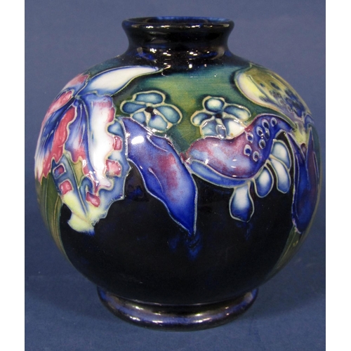 1080 - A Moorcroft blue ground vase of globular form with iris and other floral detail, with impressed sign... 