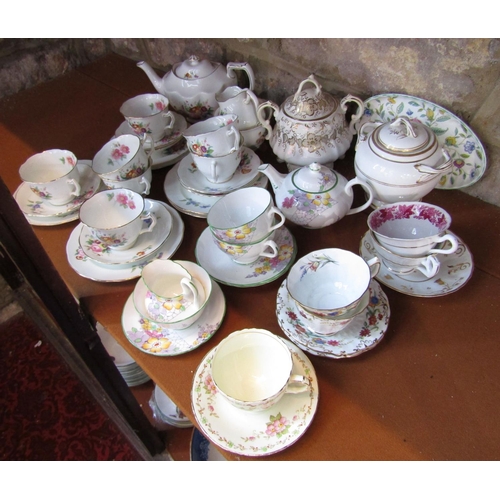 1097 - A collection of Coalport Junetime pattern teawares including teapot, milk jug, sugar bowl, seven tea... 