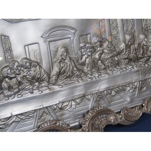 1283 - Continental white metal embossed study of The Last Supper within a white metal frame made of a scrol... 