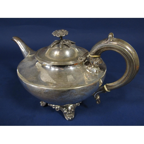 1285 - Victorian silver bullet type teapot with cast flower mount and rococo type feet, maker Frederick Dea... 