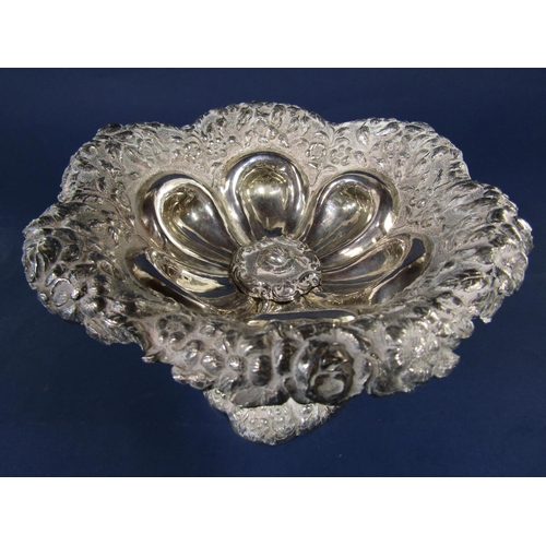 1305 - Eastern white metal (untested) pedestal dish/tazza with embossed floral rim and lobed interior, 16 c... 