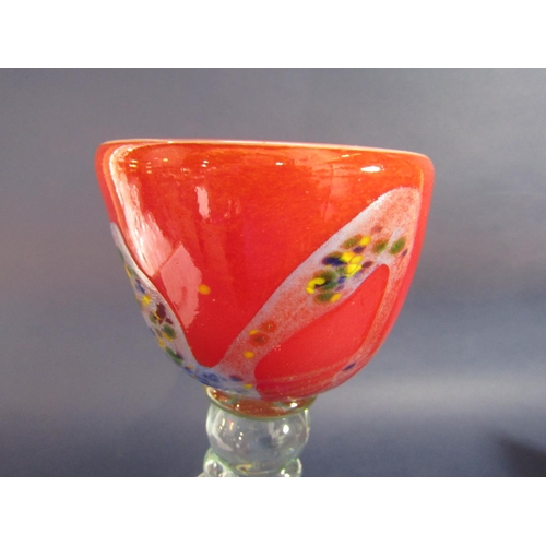 1158 - Unusual large Murano glass goblet, the red bowl with mottled sides over a clear glass wavy column an... 