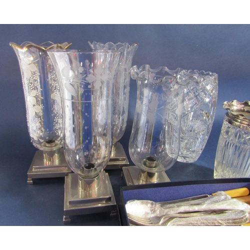 1183 - Four various glass storm lanterns on stepped square silver plated bases together with a good quality... 