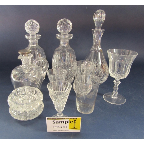 1185 - A collection of probably mainly Waterford crystal glassware comprising three decanters, a collection... 