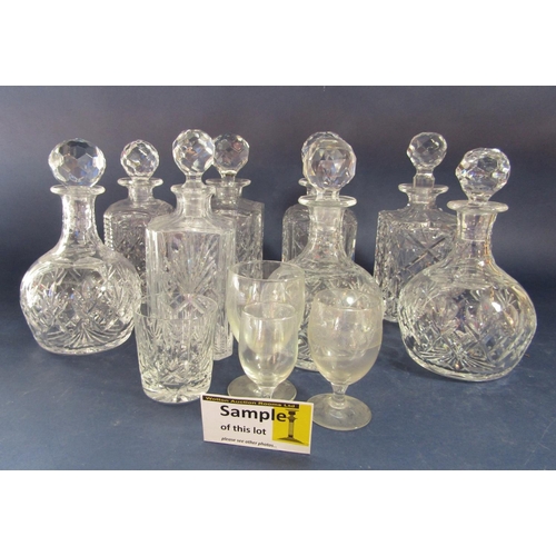 1186 - A large collection of possibly Waterford crystal glassware comprising three baluster decanters, five... 