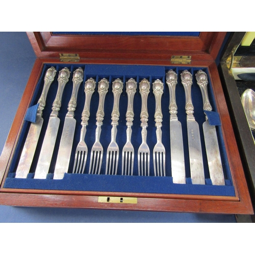 1234 - Flame mahogany cased canteen of good quality silver plated flatware with cast Art Nouveau handles ov... 