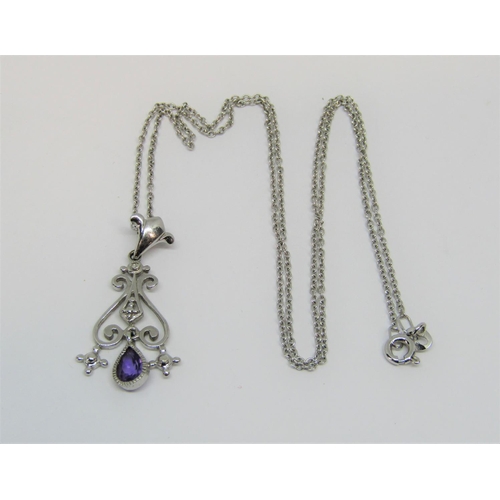 1345 - 9ct white gold pendant necklace set with a small diamond and an articulated pear cut amethyst drop, ... 