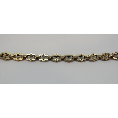 1355 - 9ct fancy link double Albert chain with T-bar and star-cut decoration, 31.8g