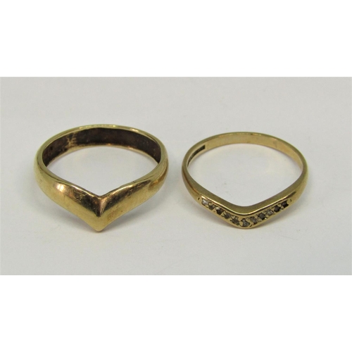 1380 - Two 9ct wishbone rings to include a diamond set example, 3.3g total (2)