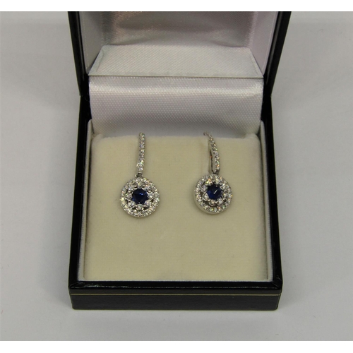 1393 - Pair of 18ct white gold sapphire and diamond cluster drop earrings, 3.6g