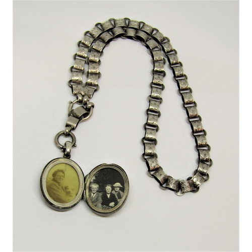 1402 - Ornate Victorian white metal locket and collar, with applied monogram and engraved foliate decoratio... 