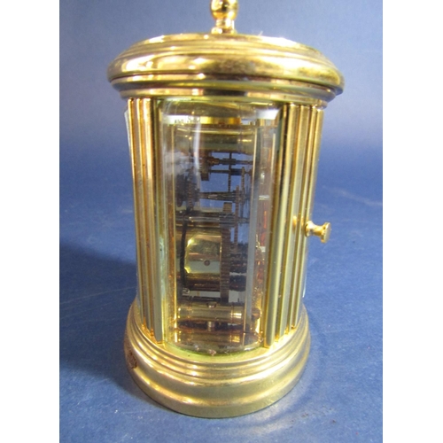 1494 - L'Epee of France oval brass case miniature carriage clock,  8 cm high