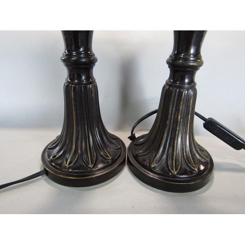 1601 - A pair of lacquered bronzed twin handled baluster vase lamps, upon darted leaf plateau bases, 60cm h... 