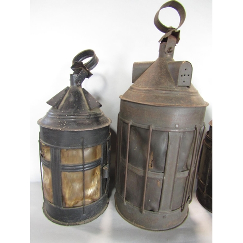 1609 - A collection of four similar conical lanterns, three with vellum type panels and grill frontage, the... 